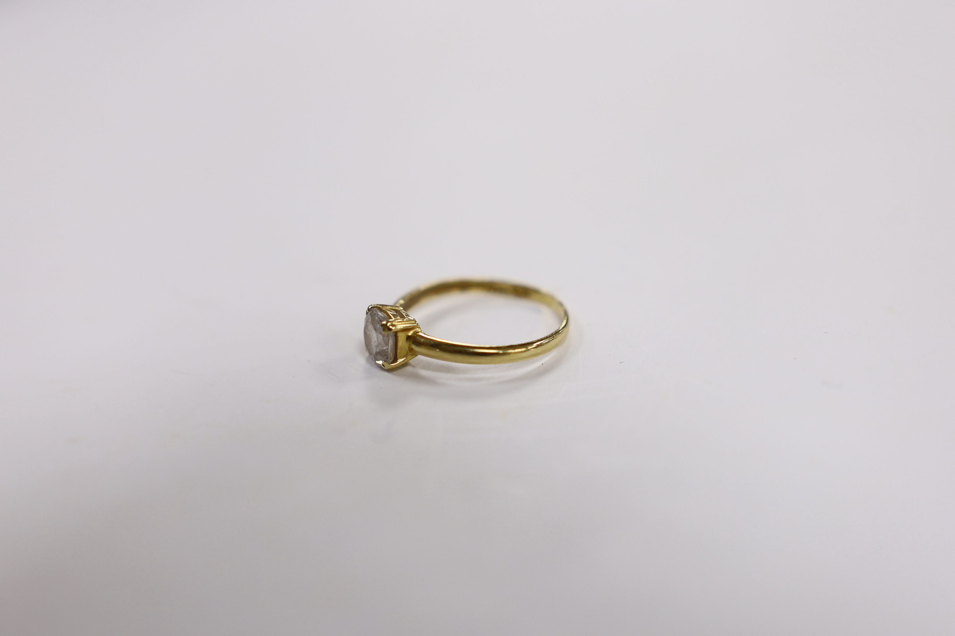 A 750 yellow metal and simulated diamond set ring, size N/O. gross weight 1.8 grams.